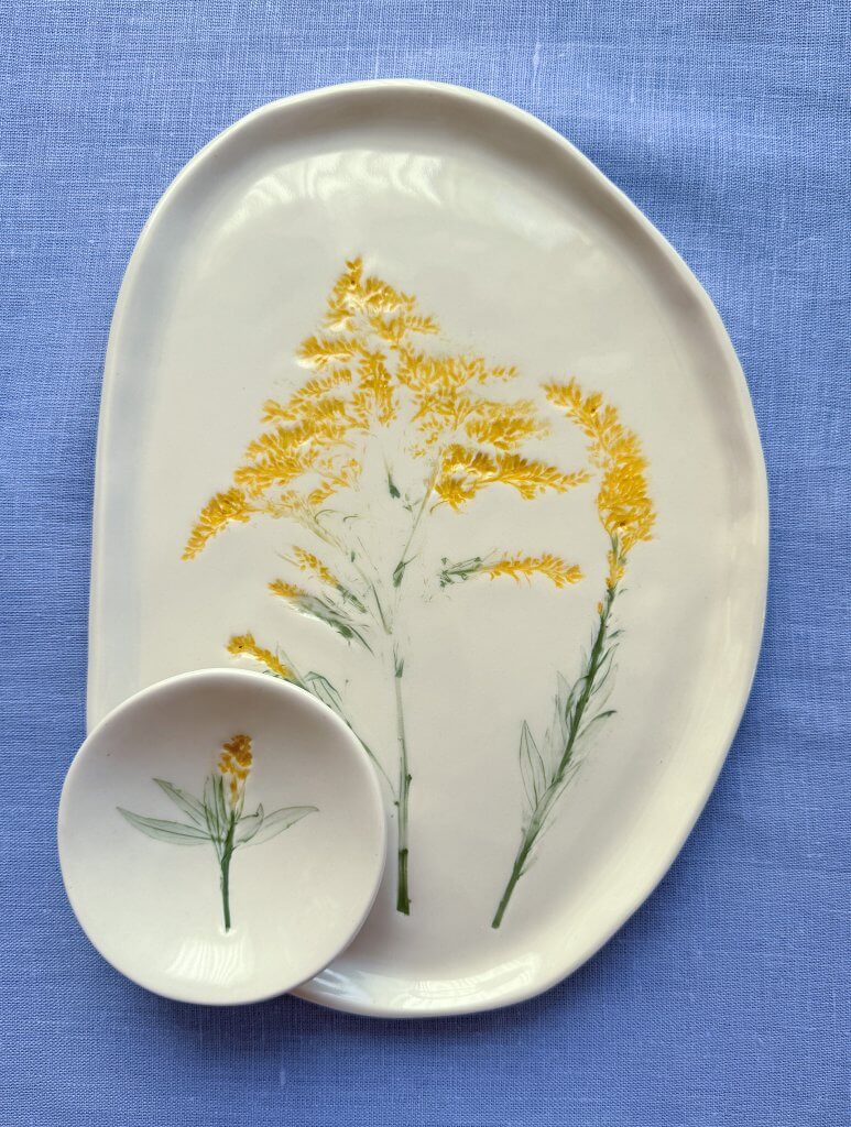 Two handmade plates featuring native plants to Door County from artist Wendy Cooper, 2026 Art in the Door Artist Laureate