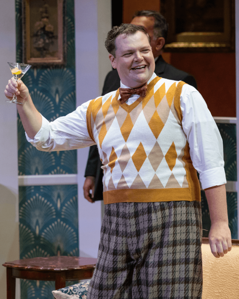 Actor Dan Klarer performing on stage.