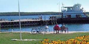 Boat Launches in Door County People sitting on a bench in front of Washington Island Dock